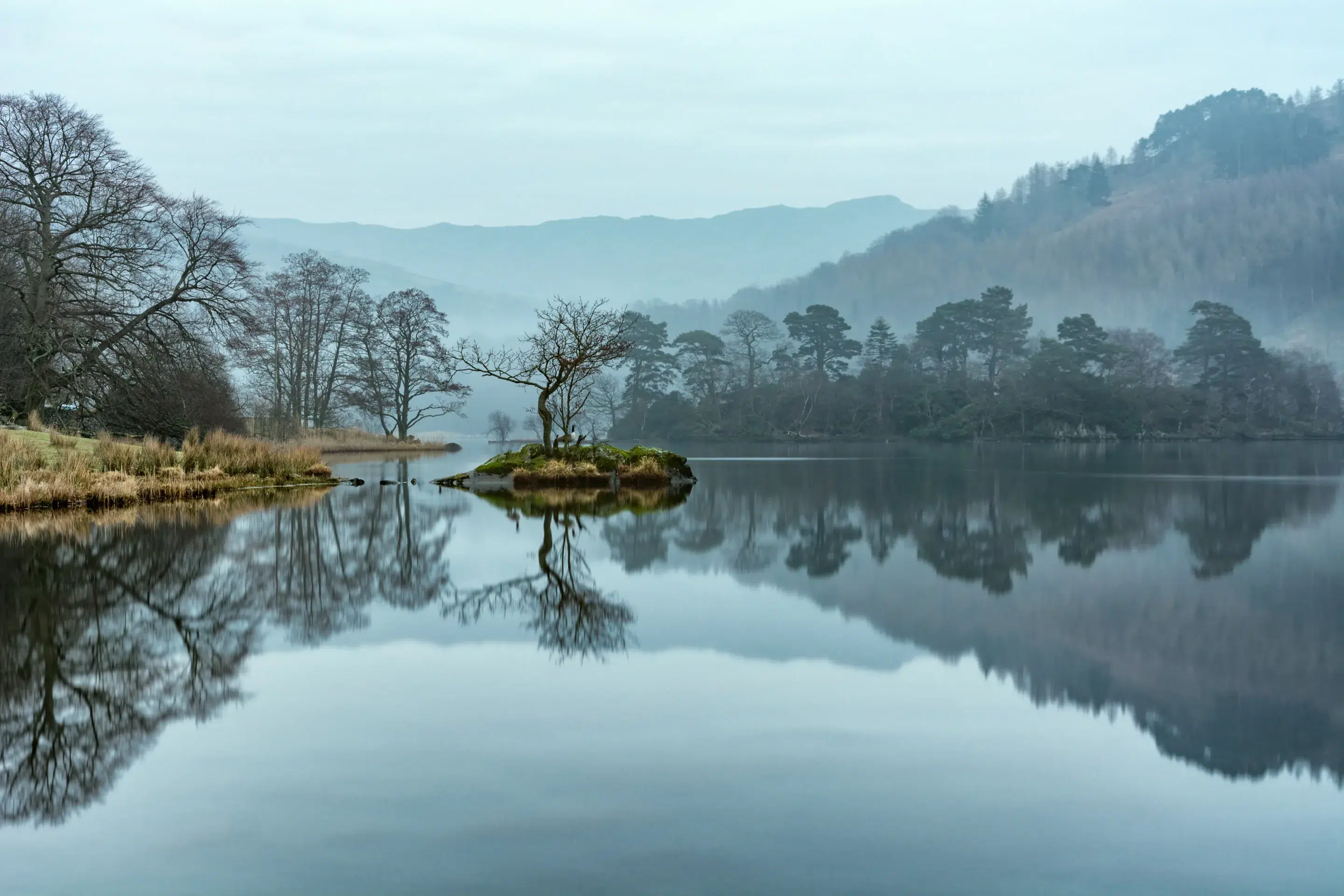 Rydal Water in the English Lake District with clear reflections on a fresh spring morning scaled scaled